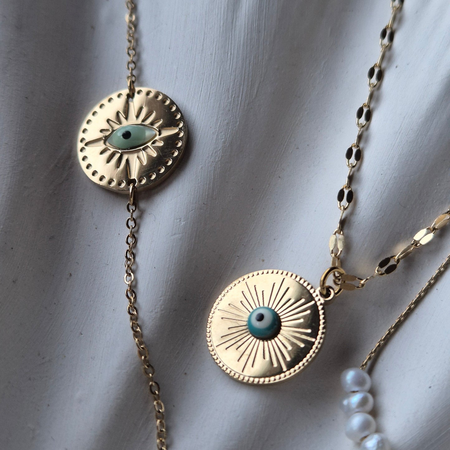 Sorella of May Iris Evil Eye Gold Necklace along side Evil Eye Bracelet