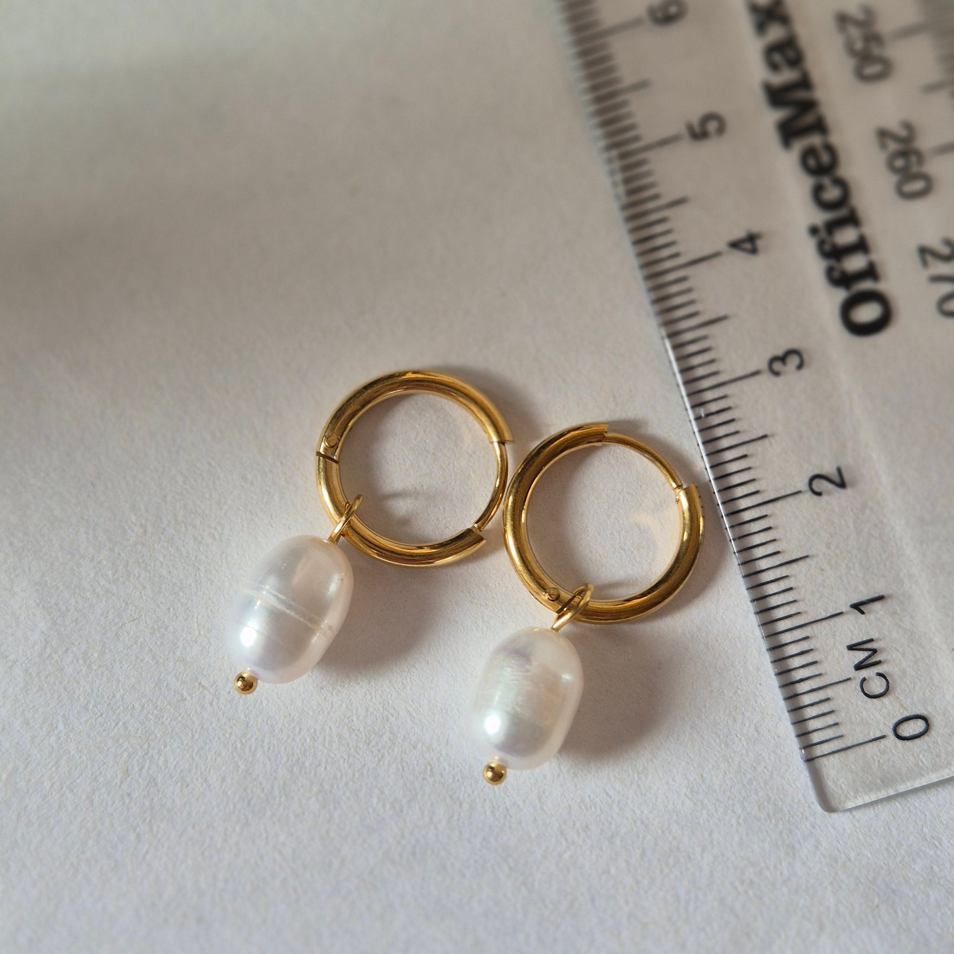 Sorella of May oceane earring beside ruler