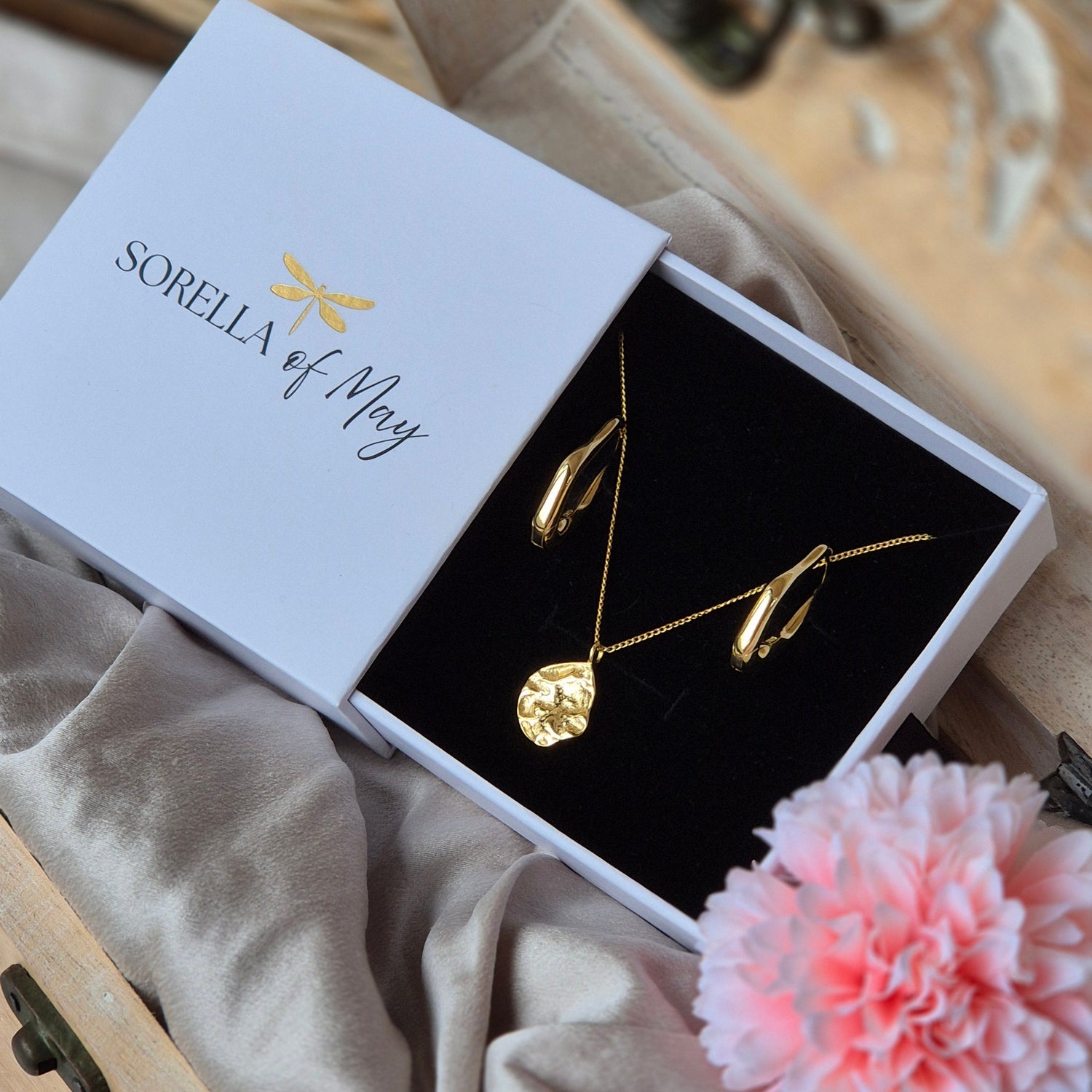 Sorella of May gold Maris pendant necklace and Serra Earrings in our signature keepsake box.