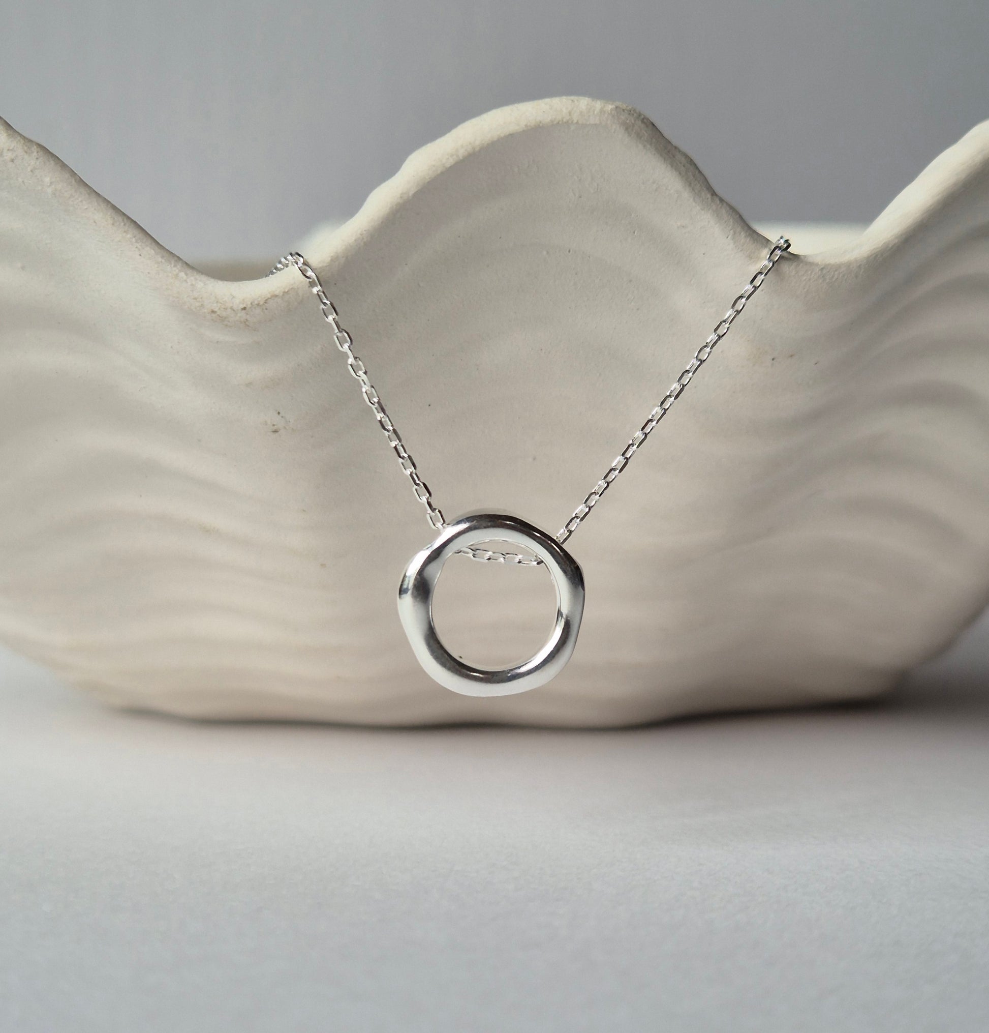 Sorella of May Gwen necklace on dish
