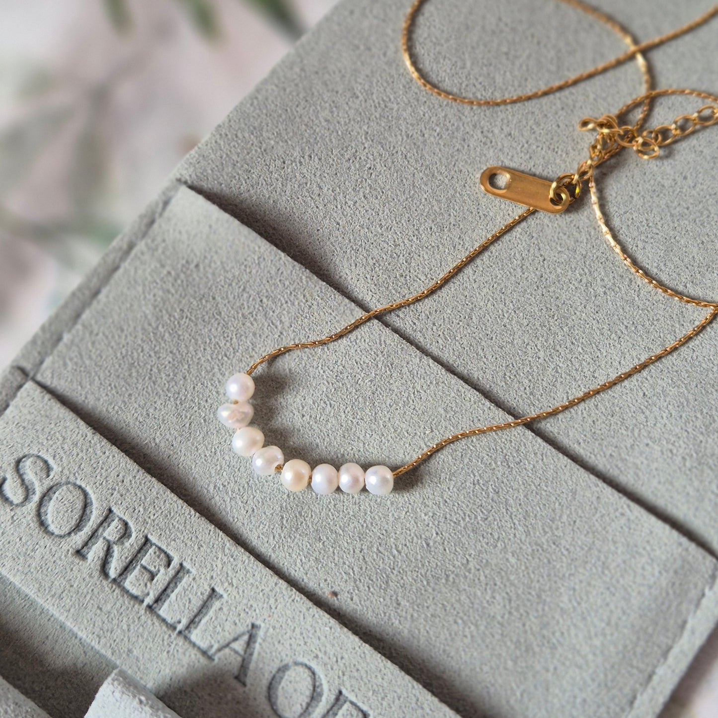 Sorella of May Nerina necklace on pouch