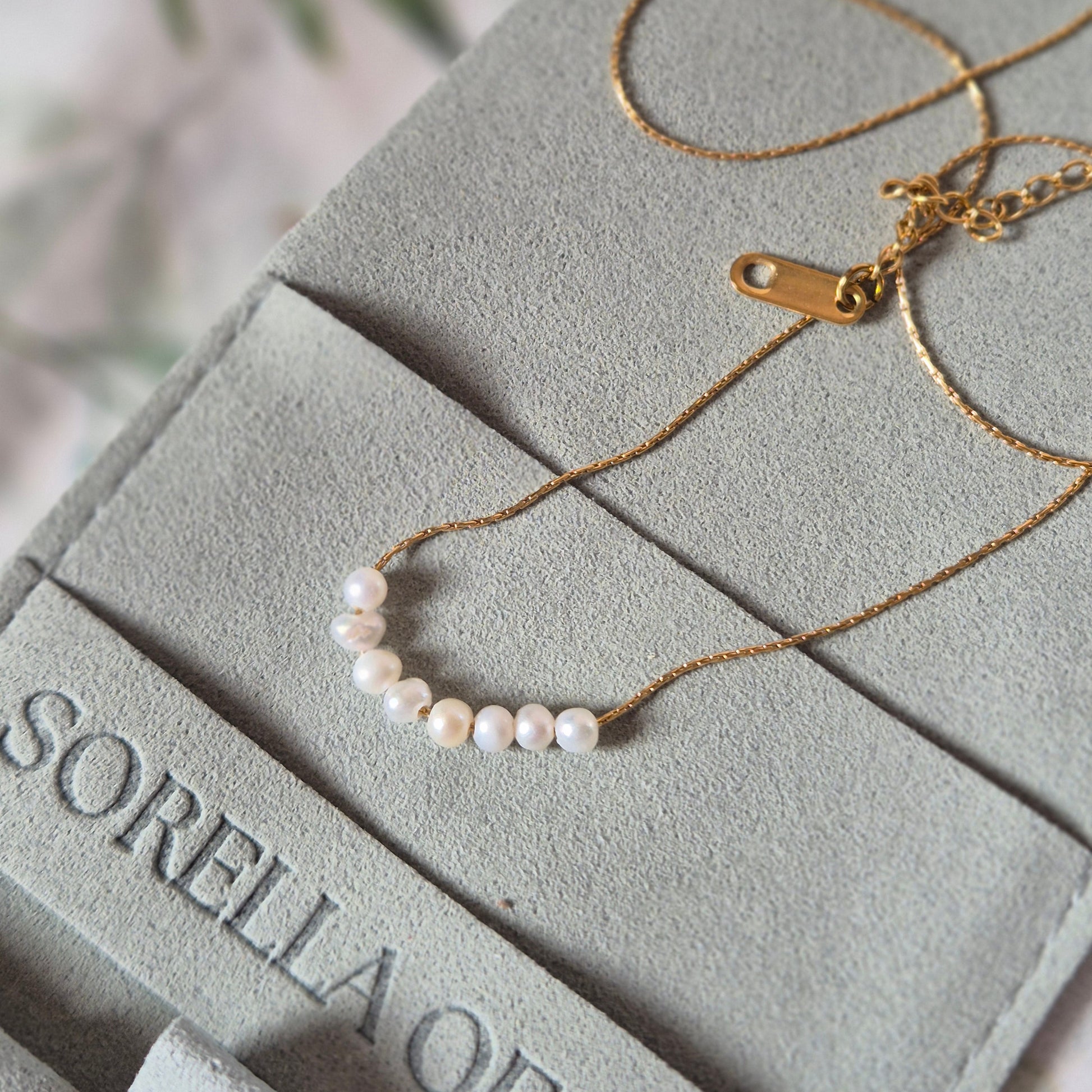 Sorella of May Nerina necklace on pouch